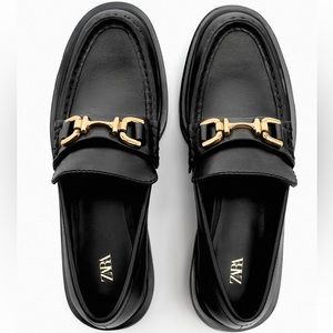 Lug Sole Black Leather Loafers with gold metal detail